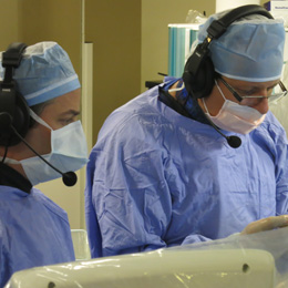 Picture of doctors wearing face mask and a headset
