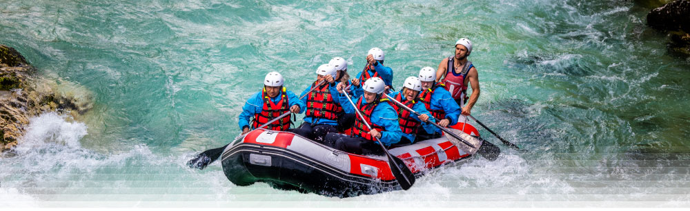 a team doing whitewater rafting