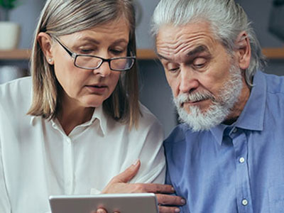couple looking up health information on a tablet