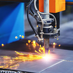 CNC machine cuts metal material
