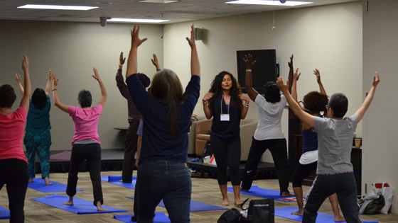 Image of participants learn how to do Yoga