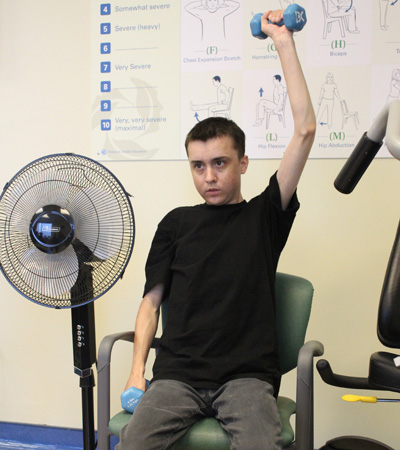 Image of Reid lifting weights 