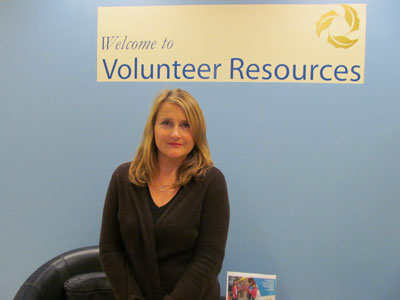 Picture of Mary-Ann in front of Volunteer sign