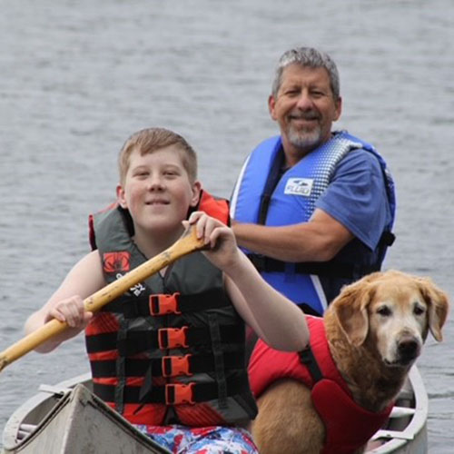 Jack and his dad canoeing
