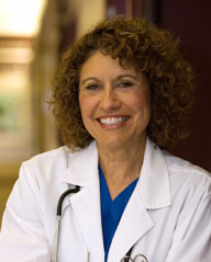 Smiling female doctor wearing labcoat