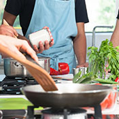 group of people taking a cooking class