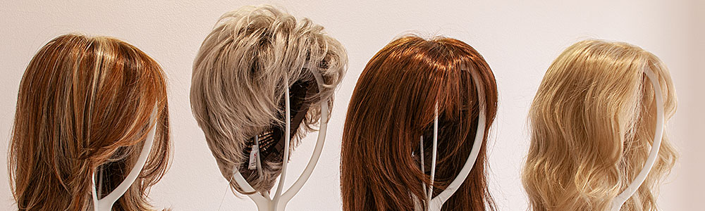 four wigs on display