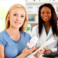 Image of patient picking up prescription at the pharmacy