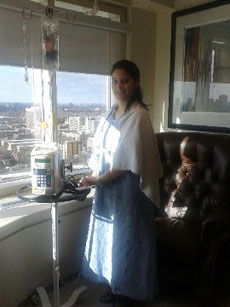 Adriana Lombardo standing near window in hospital room 