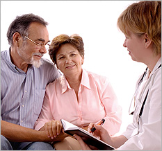 Middle-aged couple leaning on each other and speaking to a physician