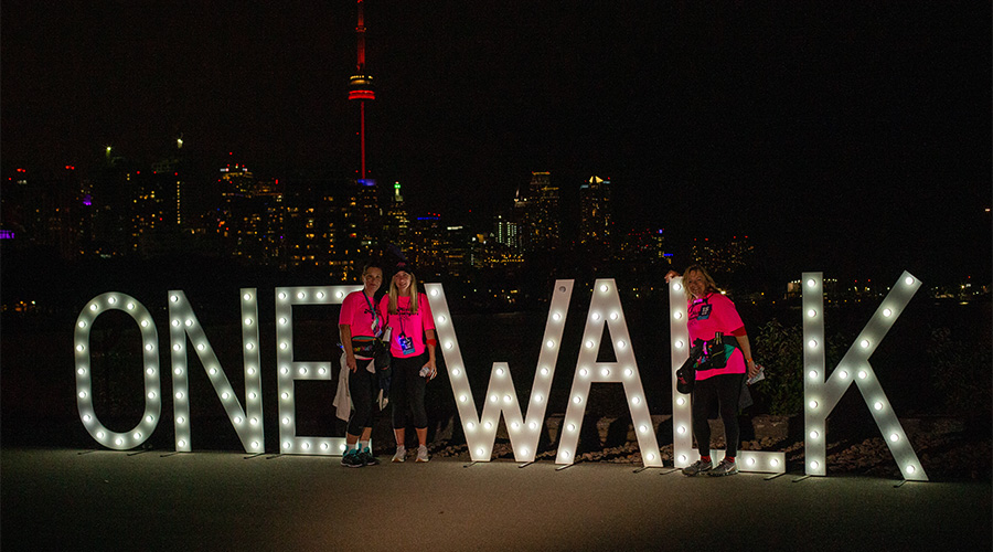Women in pink at Toronto sign 