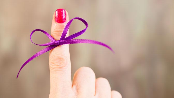 finger with purple ribbon 