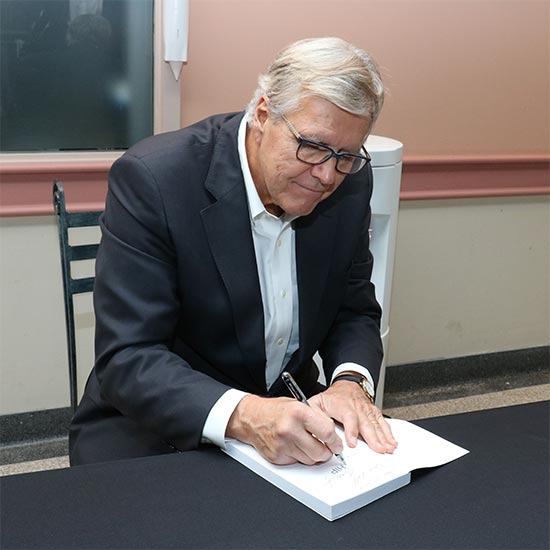 Bob Bell signing a book