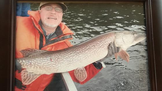 Dr. Maxymiw with a catch-and-release pike