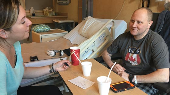Patrick and his wife in hospital room 