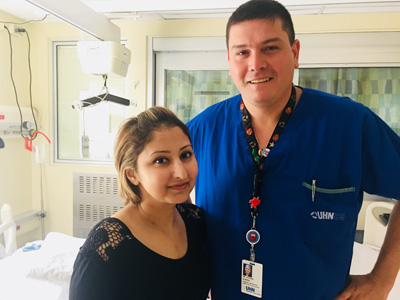 Aisha poses with heart surgeon Dr. Alvarez
