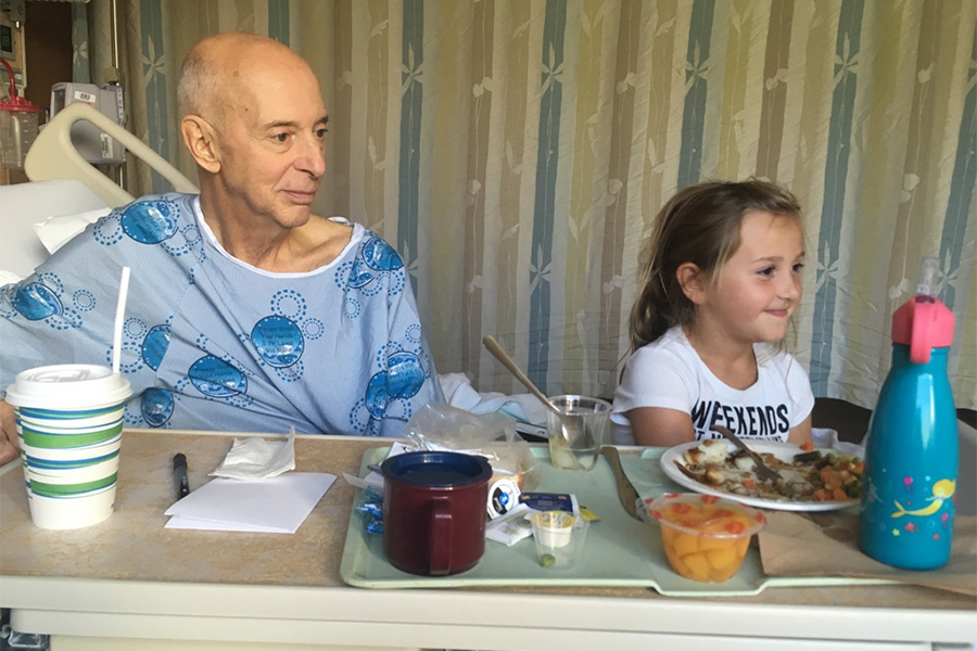 Bill and Granddaughter before Implant