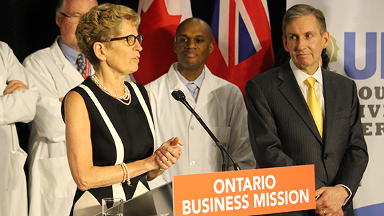 Picture of Premier Wynne and Dr. Pisters at news conference 