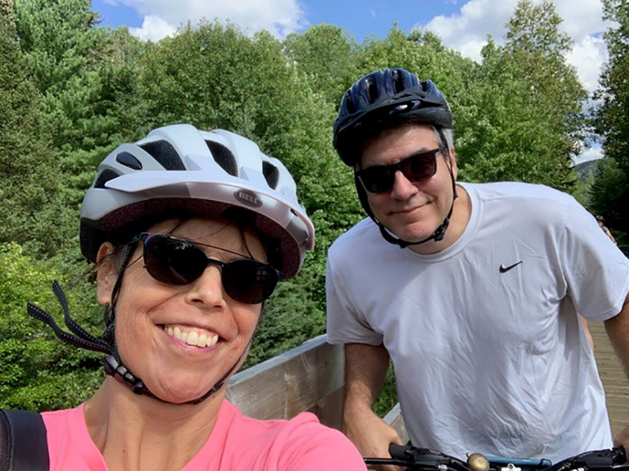 Woman and man in bicycle helmets 