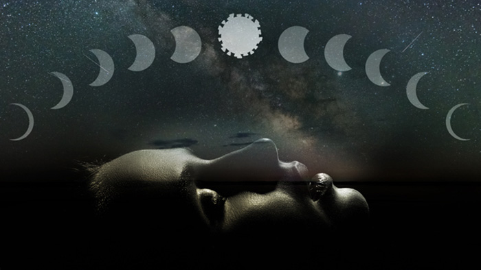 Image of person sleeping with moons above 