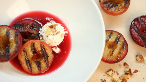 Grilled plums with almond mascarpone on plate