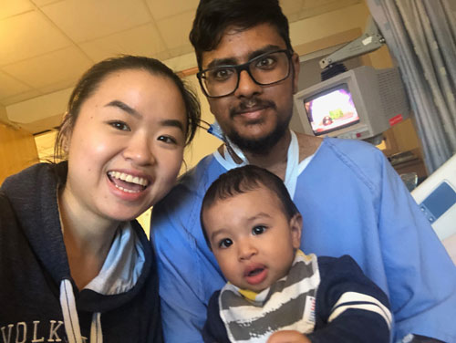 Amir with his wife and their son