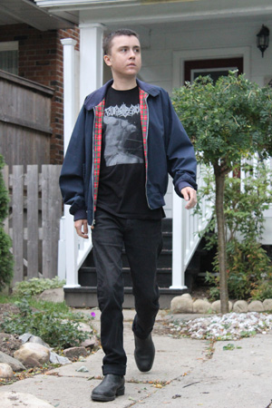 Image of Reid walking outside his Toronto home