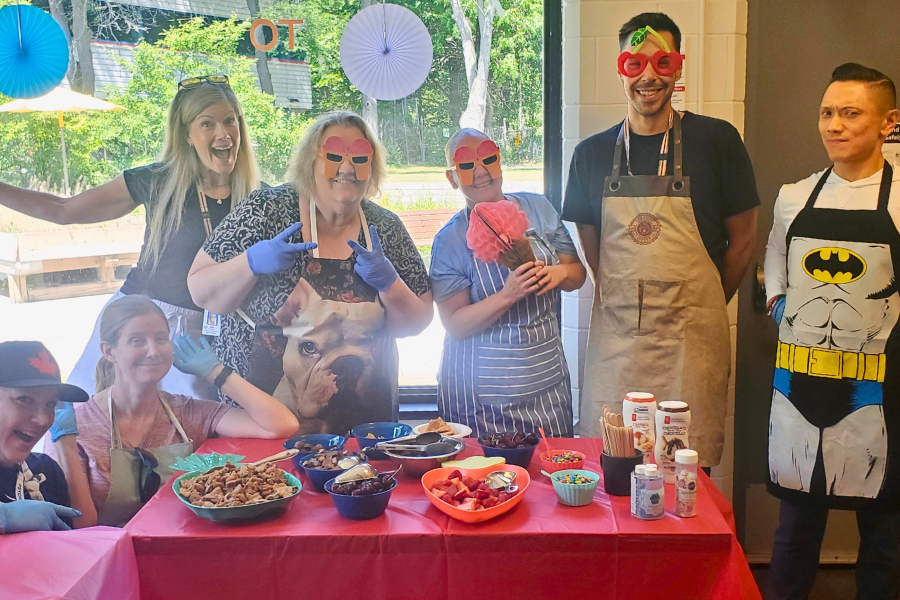 Group photo of team members serving ice cream