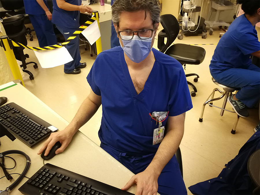 Dr. David Carr in scrubs 