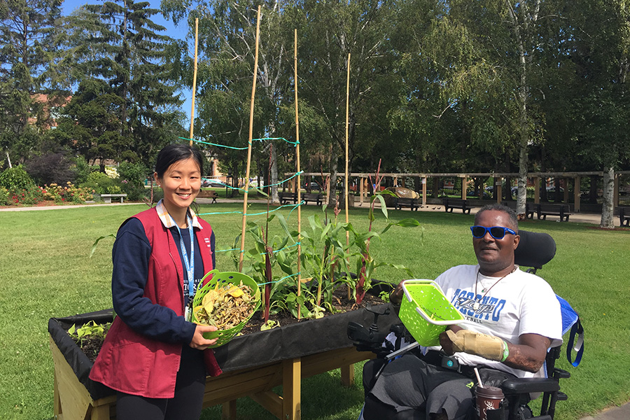 2 people in wheelchair-accessible garden