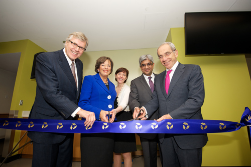 Dr. Bob Bell, Elizabeth Witmer, Mary Hall, Dr. Nizar Mahomed, and David Marshall cut the ribbon at Krembil