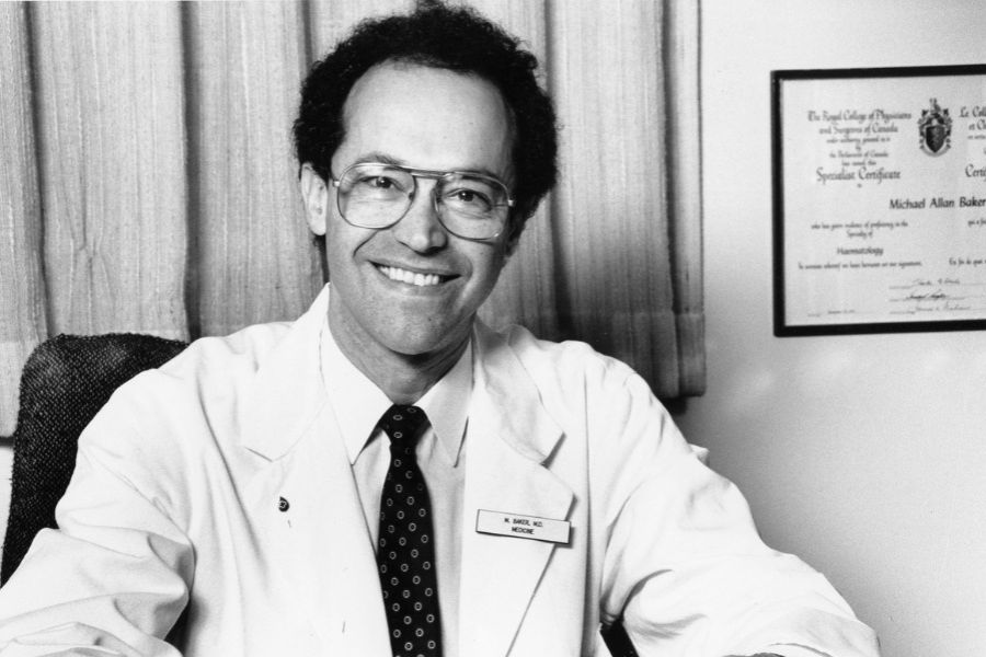 A black and white photo of Dr. Michael Baker