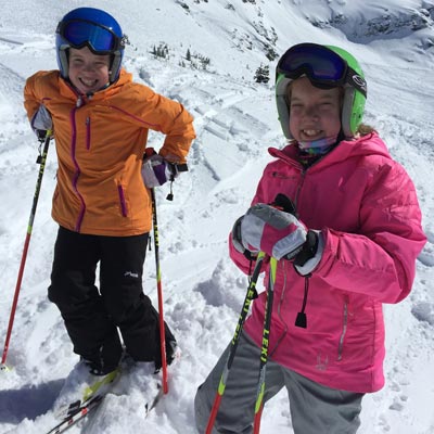 photo of girls skiing 