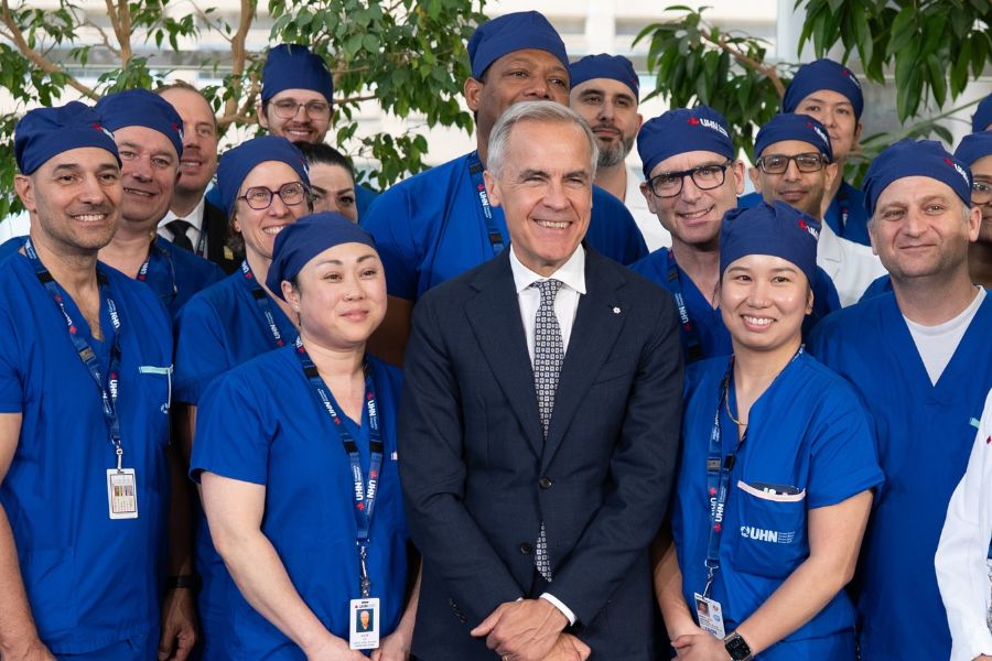 Canada's Prime Minister, Mark Carney posing with UHN healthcare workers