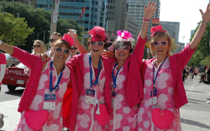 Women dressed in pink wave image