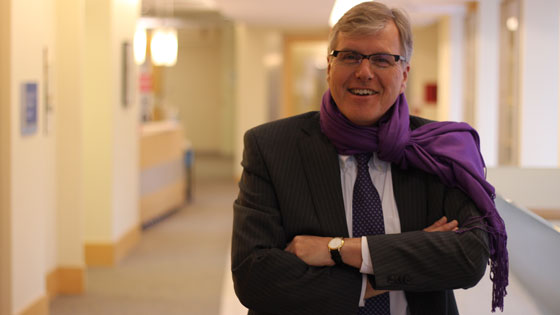 UHN CEO Dr. Bob Bell wears a purple scarf and tie in support of epilepsy awareness.