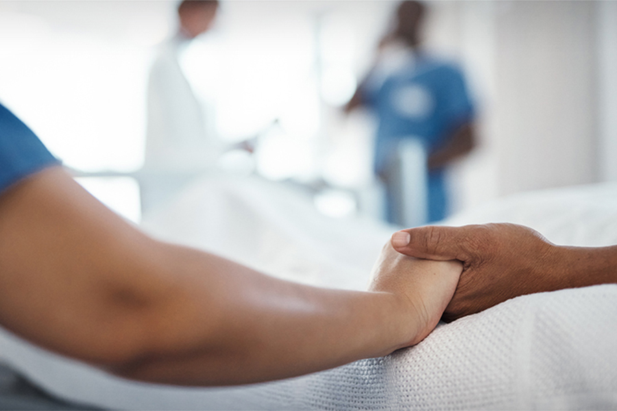 Two people holding hands