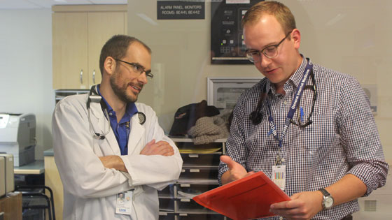 Dr. Tom MacMillan (left) and GIM resident Dr. Kevin Venus 
