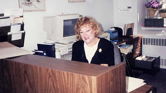 Ruth at desk in the 1990s 