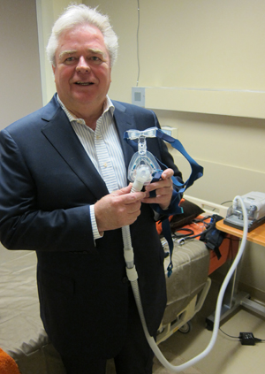 Dr. Bradley holding breathing mask image