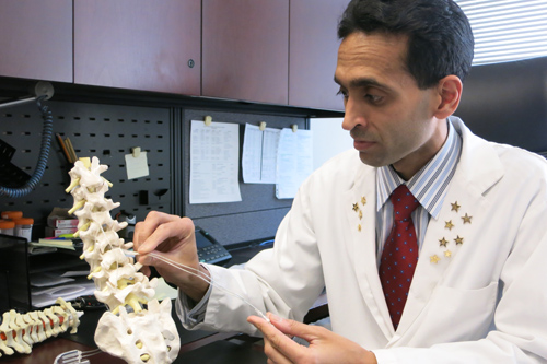 Dr. Mohammed Shamji demonstrates how a spinal cord stimulator alleviates pain