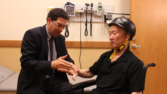 Image of Dr. Mark Bayley with patient Wing-Yiu Tang
