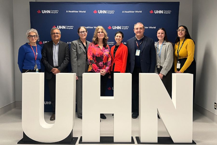 ​​​TeamUHN members in front of the big letters that spell UHN