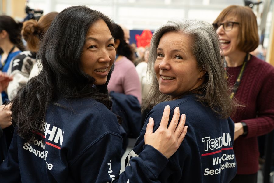 TeamUHN members posing with new UHN sweaters