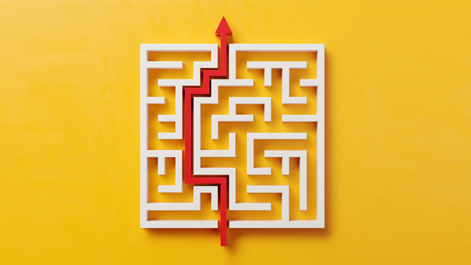 maze with red arrow through it 