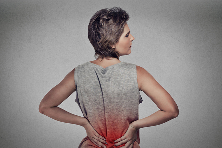 Woman holding her sore back