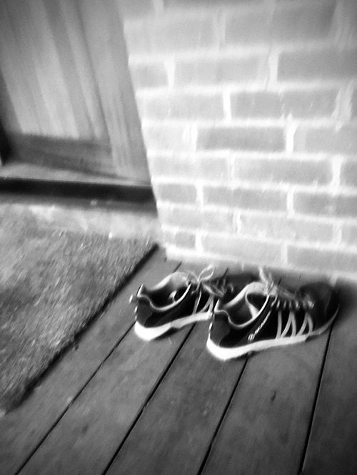 Shoes outside door of house