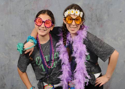 Image of Ruby and Sydney dressed up in sunglasses and feather boas