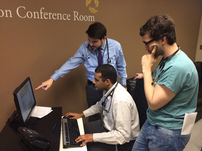 Residents and Physicians collaborating to complete a Discharge Summary 