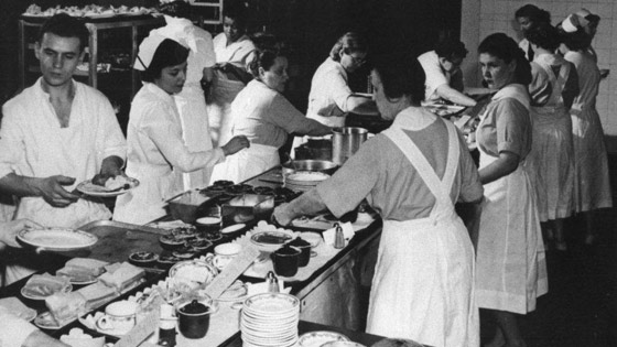 Image of assembly line where hospital staff prepared each dish for patients